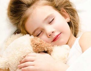 a child grinds his teeth while sleeping